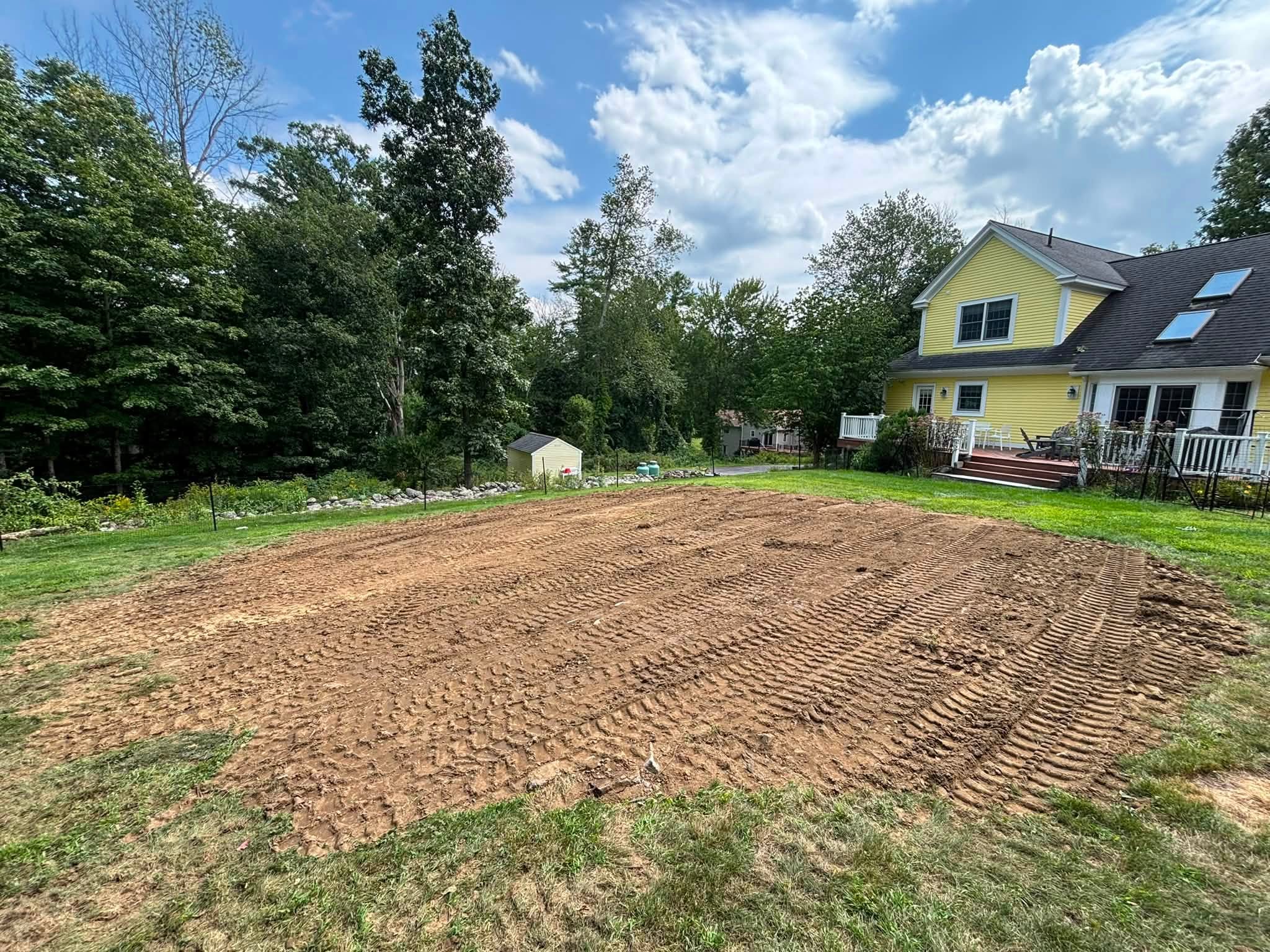Hillside reshaped — existing material redistributed on site